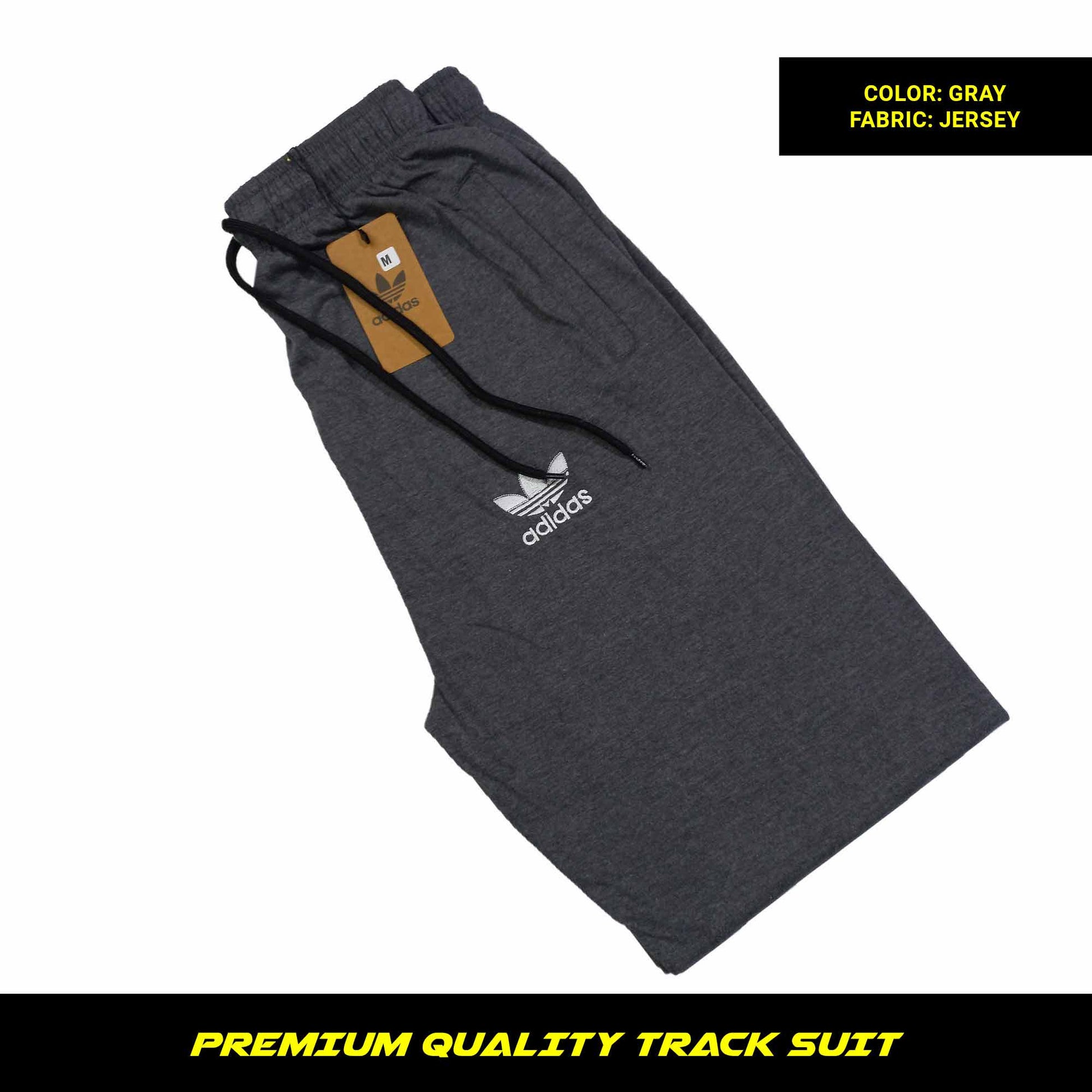 Gray men's premium jersey tracksuit with round neck and half sleeves. Tape to fasten trousers at waist. Loose-fitting. Zipper pockets. Perfect for workouts and casual wear.